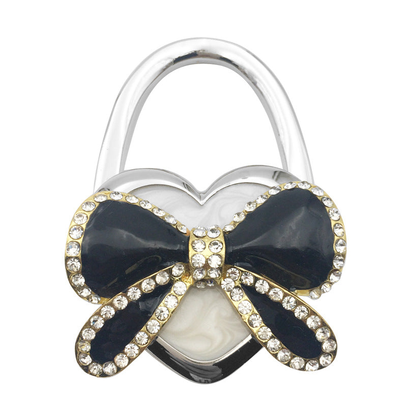 Wholesale Bow Hanging Creative and Practical Girl Bag Hook Folding Bag Hook At The Table