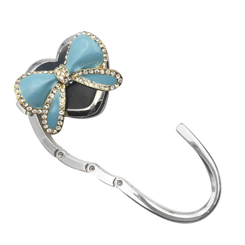 Wholesale Bow Hanging Creative and Practical Girl Bag Hook Folding Bag Hook At The Table