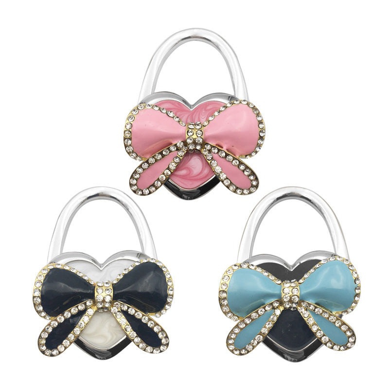 Wholesale Bow Hanging Creative and Practical Girl Bag Hook Folding Bag Hook At The Table