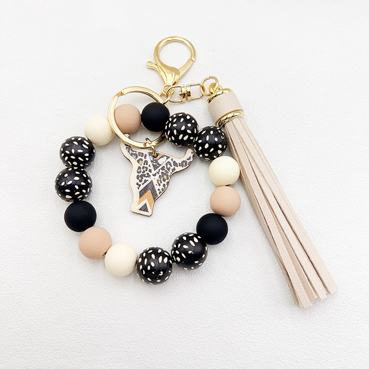 Wholesale Wooden Ox Head Sesame Spotted Wooden Beads PU Tassel Wrist Keychain