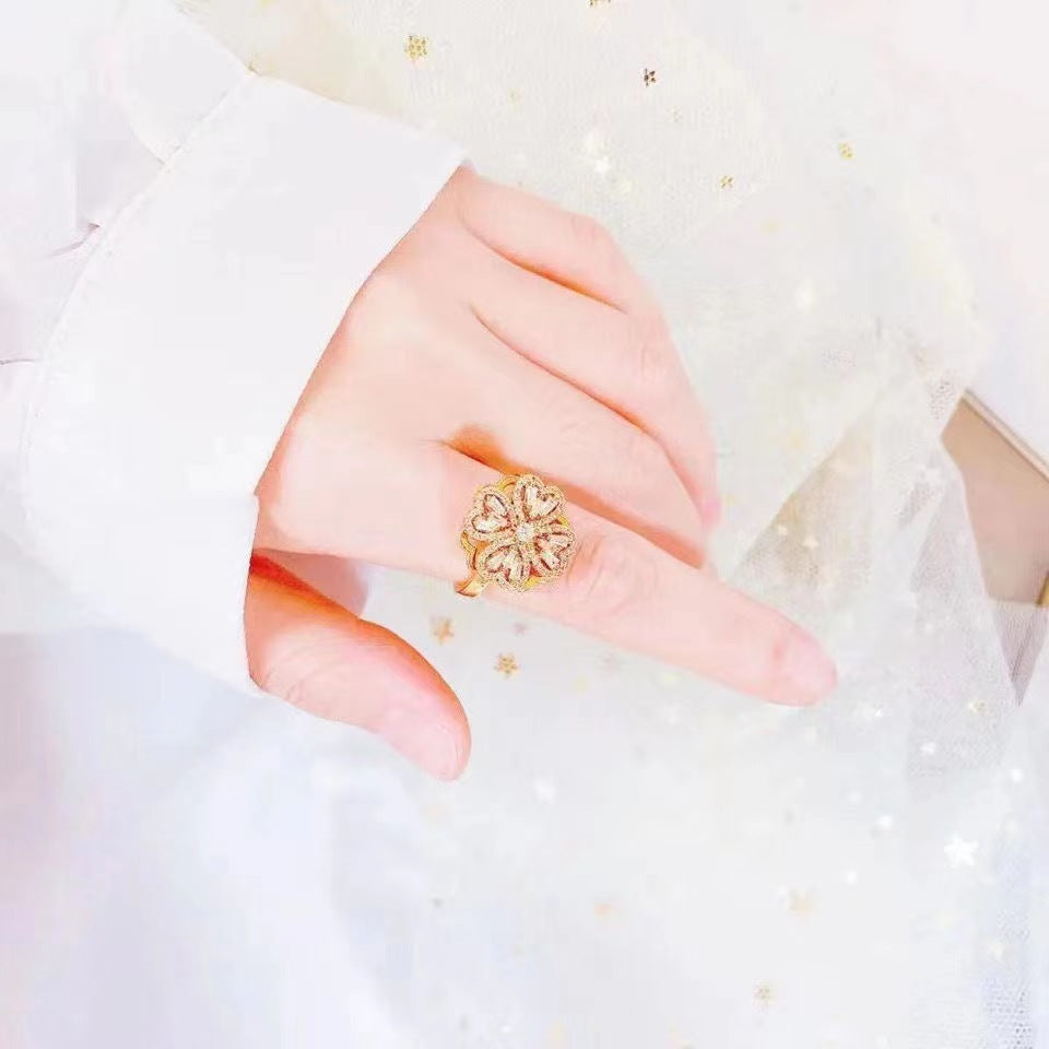 Anillo de cobre de trébol de cuatro hojas rotativo al por mayor