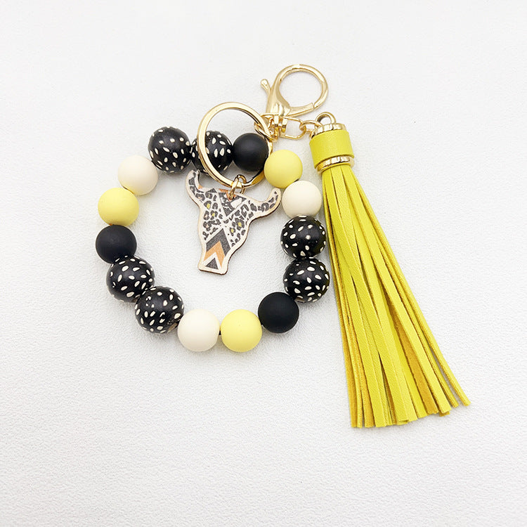 Wholesale Wooden Ox Head Sesame Spotted Wooden Beads PU Tassel Wrist Keychain