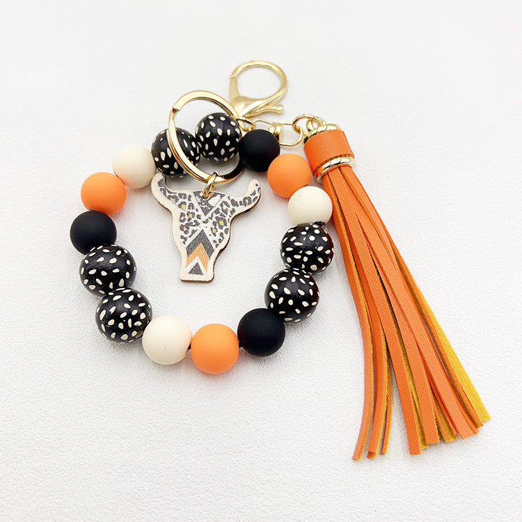 Wholesale Wooden Ox Head Sesame Spotted Wooden Beads PU Tassel Wrist Keychain