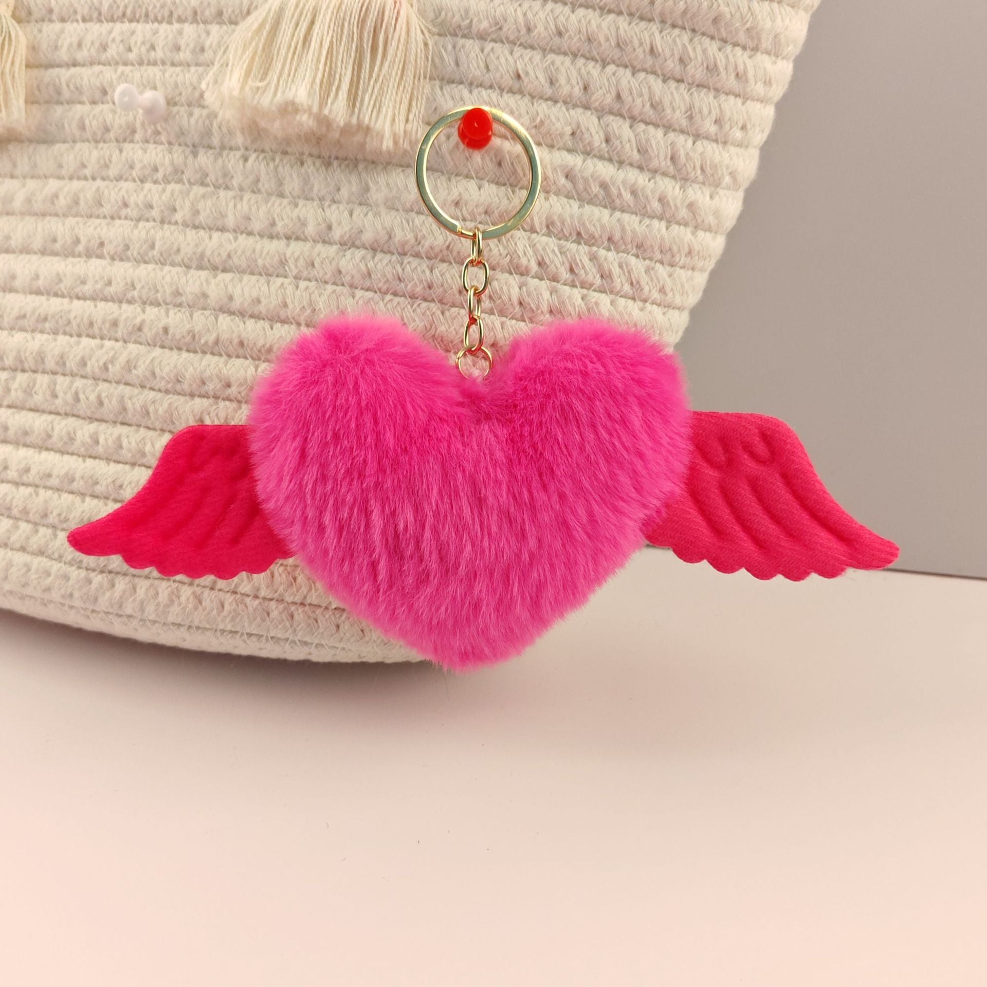 Wholesale Heart wings fur ball keychain