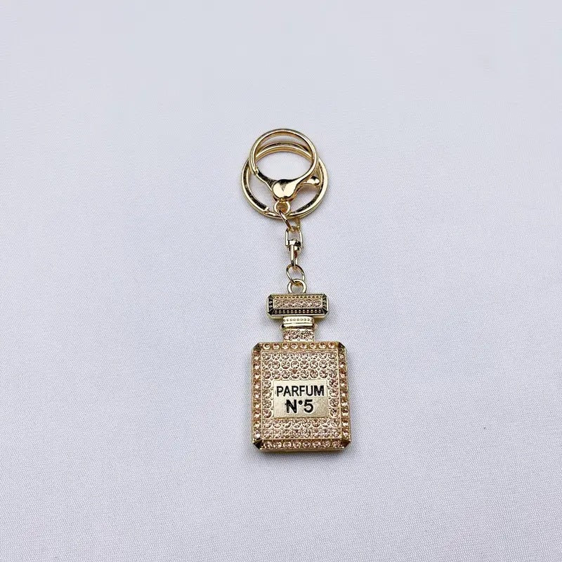 Wholesale Diamond-studded perfume bottle creative metal keychain
