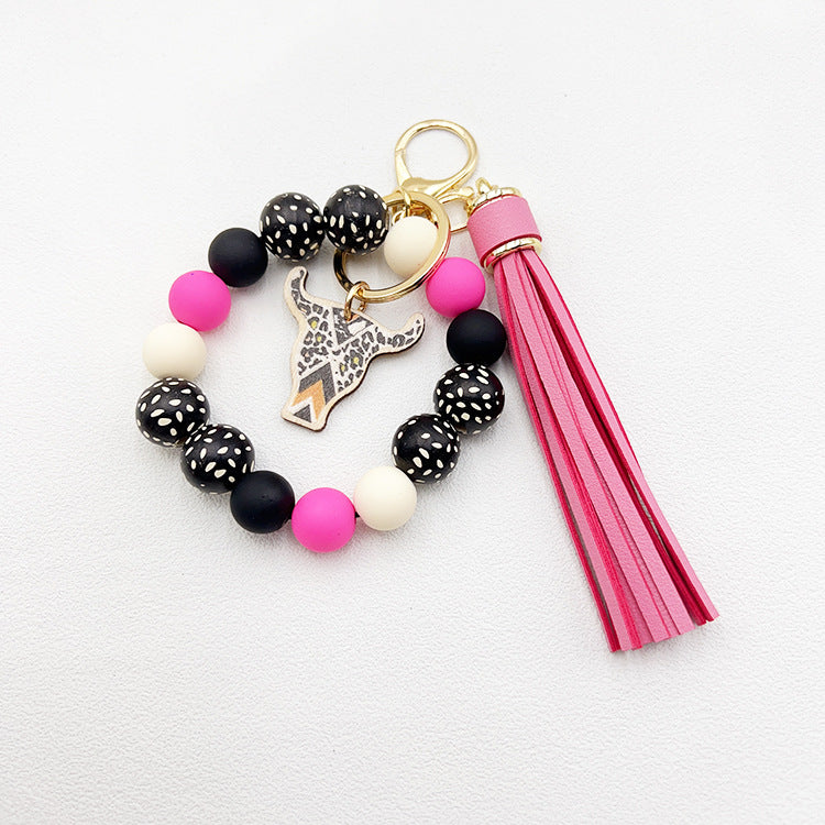 Wholesale Wooden Ox Head Sesame Spotted Wooden Beads PU Tassel Wrist Keychain