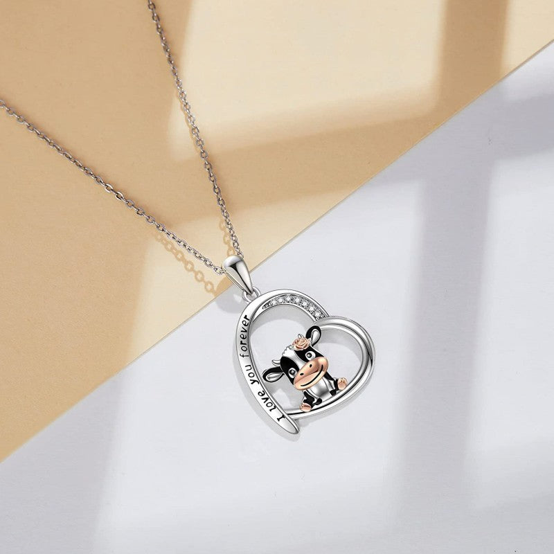 Wholesale of 10PCS Cute Cow Printed and Carved Heart Shaped Alloy Necklace