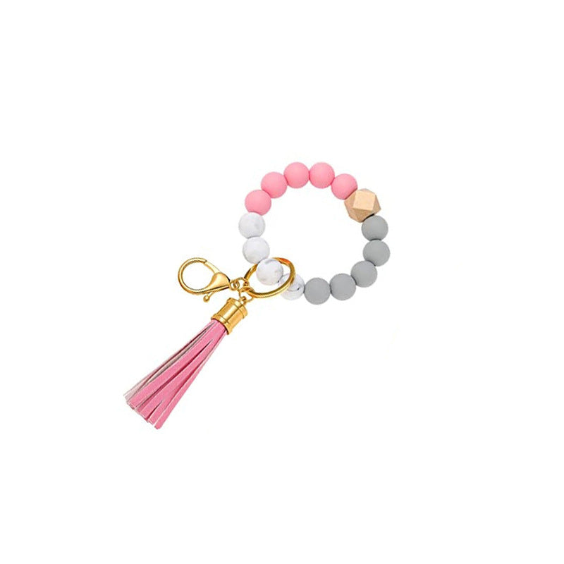 Llavero al por mayor de la muñeca de la mano de la borla del cuero del cordón del silicón del estampado de leopardo