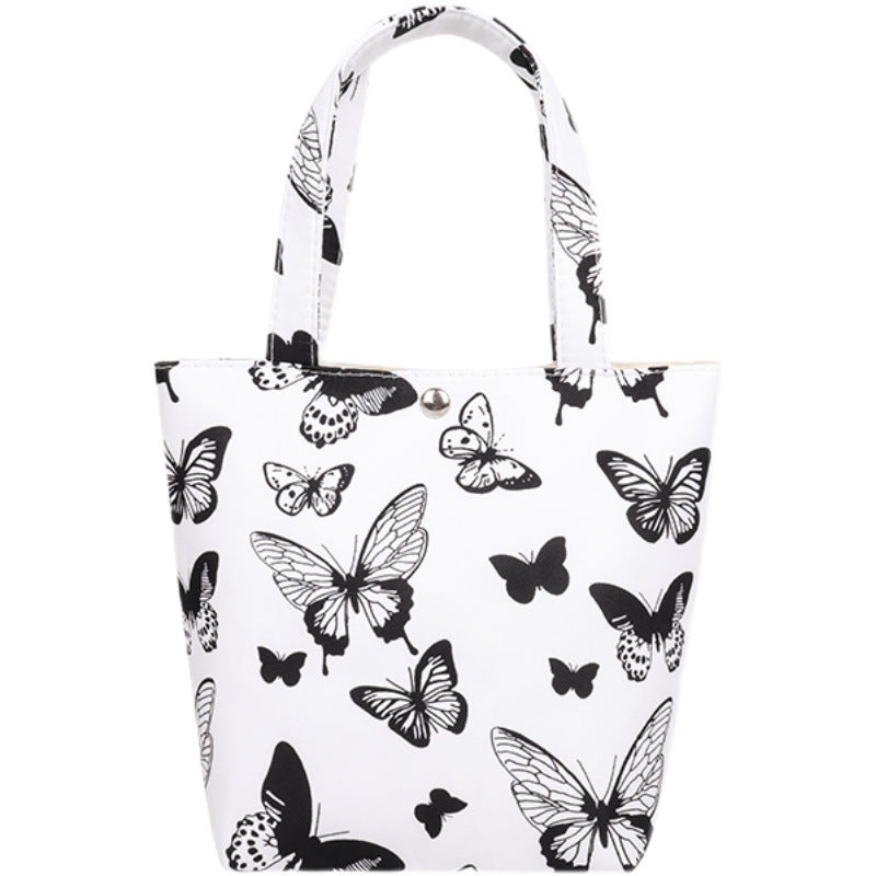 La bolsa de asas de mariposa con estampado de leopardo y estampado de vaca de poliéster al por mayor