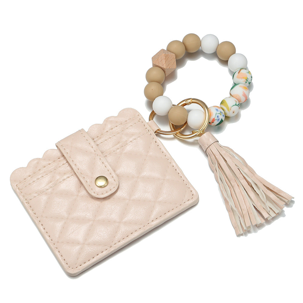 Venta al por mayor Llavero de muñeca con cuentas de silicona para portatarjetas