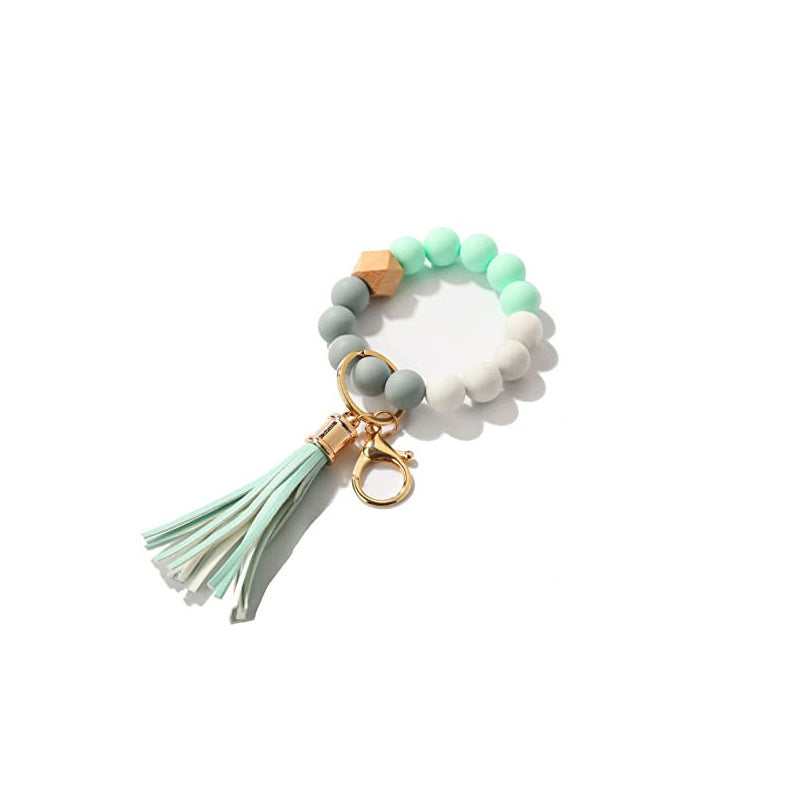 Llavero al por mayor de la muñeca de la mano de la borla del cuero del cordón del silicón del estampado de leopardo