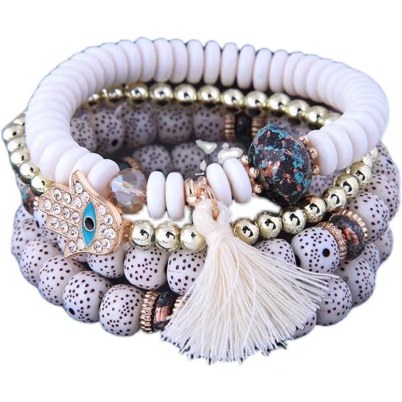 Venta al por mayor Pulsera de aleación de borla de ojos azules malvados