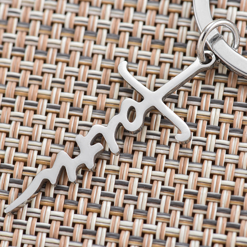 Venta al por mayor Llavero cruzado del alfabeto del acero inoxidable