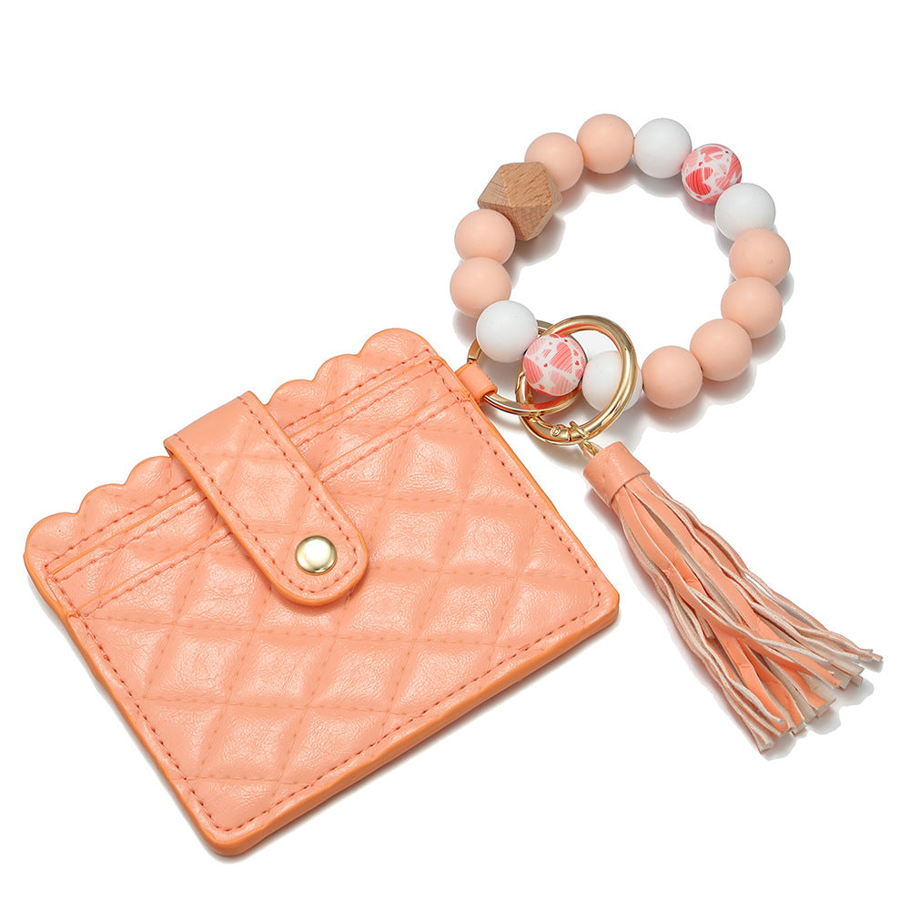 Venta al por mayor Llavero de muñeca con cuentas de silicona para portatarjetas