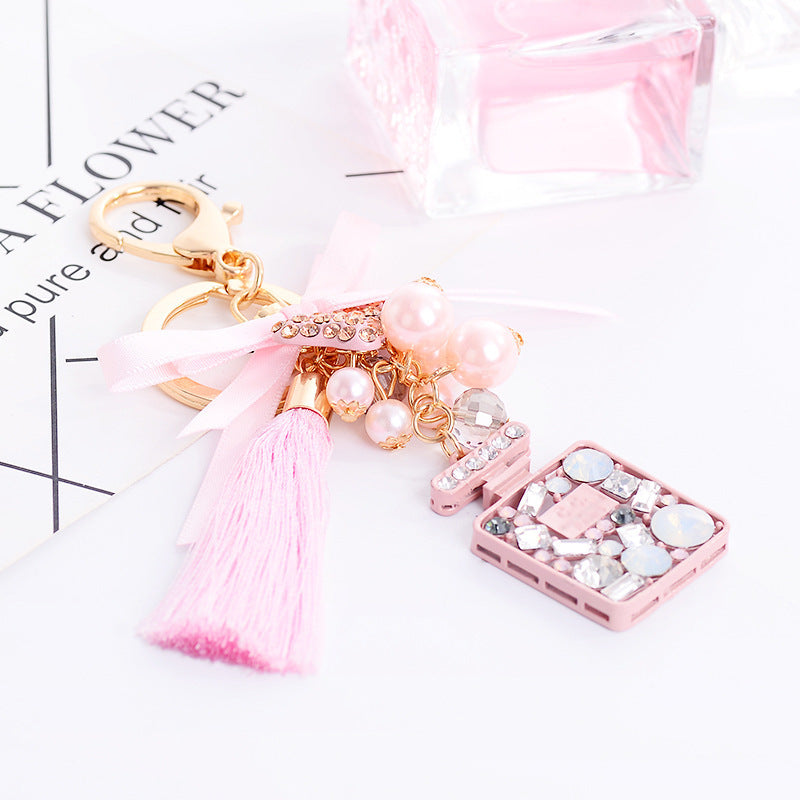 Wholesale Bow Ice Silk Tassel Perfume Bottle Zinc Alloy Keychain