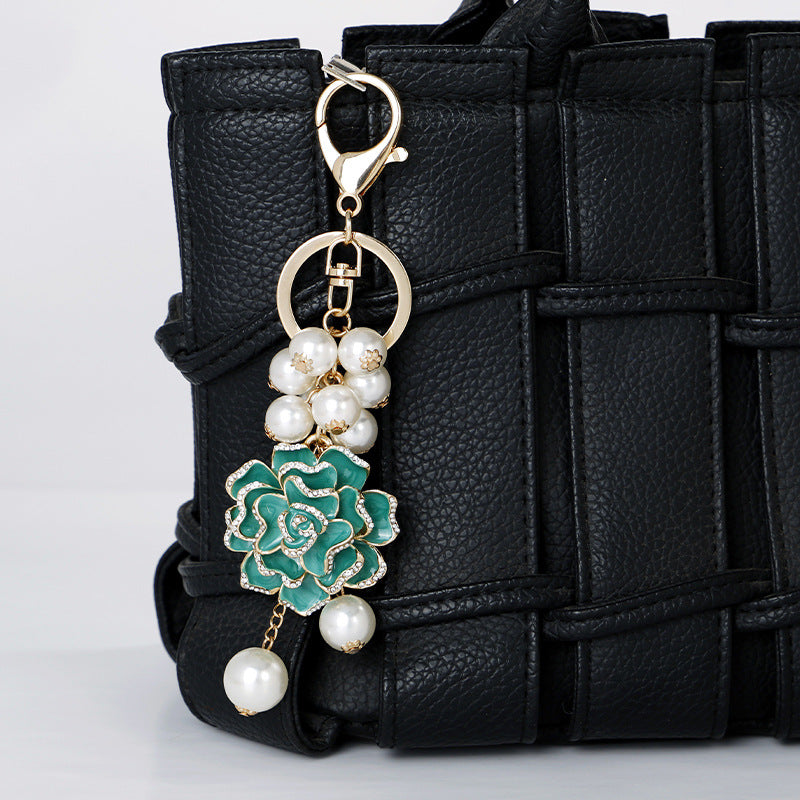 Wholesale Flower series oil dripping diamond inlaid camellia metal keychain