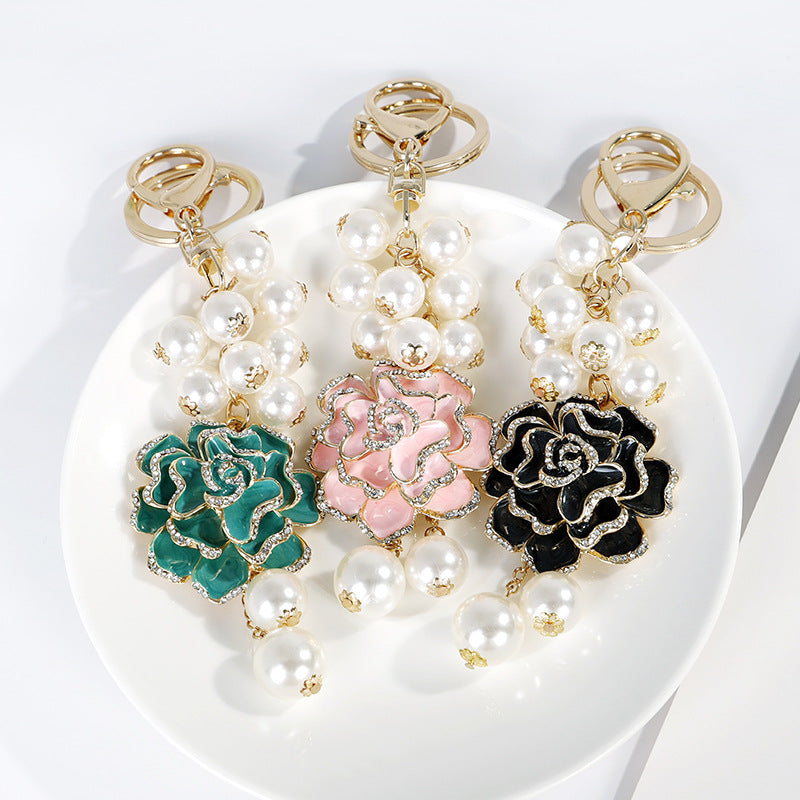 Wholesale Flower series oil dripping diamond inlaid camellia metal keychain