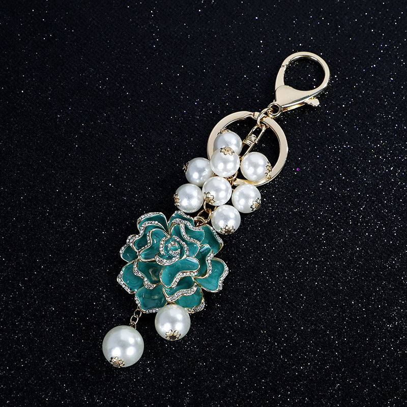 Wholesale Flower series oil dripping diamond inlaid camellia metal keychain