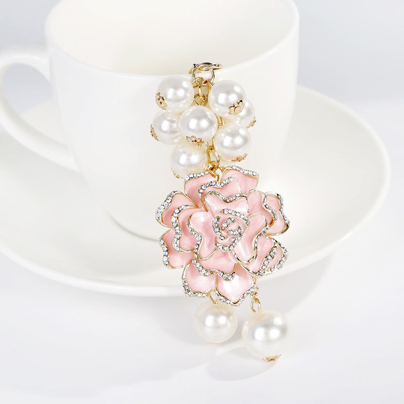 Wholesale Flower series oil dripping diamond inlaid camellia metal keychain
