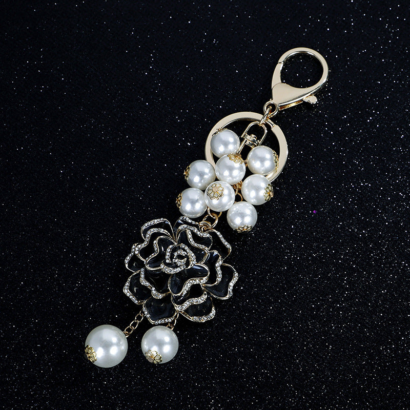 Wholesale Flower series oil dripping diamond inlaid camellia metal keychain