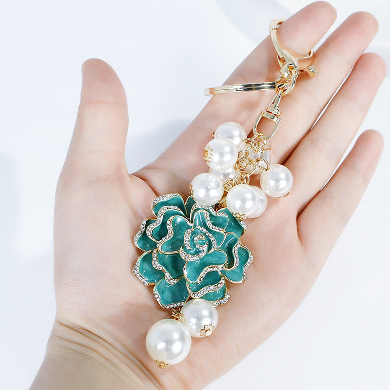 Wholesale Flower series oil dripping diamond inlaid camellia metal keychain