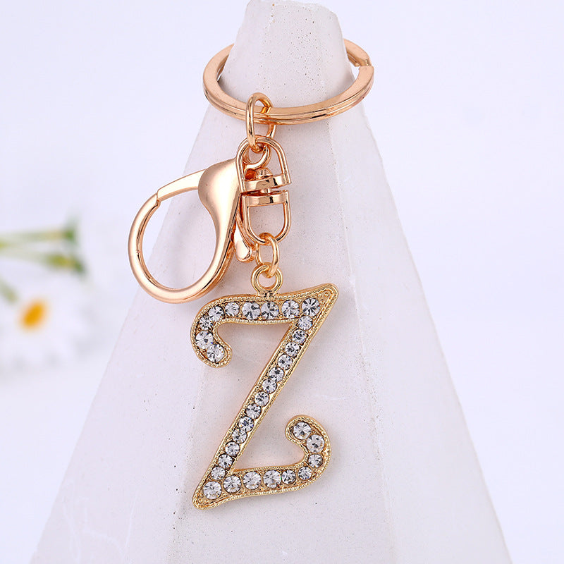 Aleación de zinc al por mayor 26 Inglés Alphabet Rhinestone Keychain