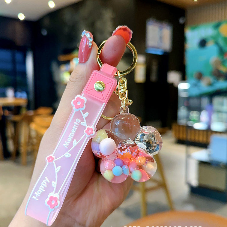 Wholesale Transparent Acrylic Oil Night Flower Flowing Sand Bottle Keychain