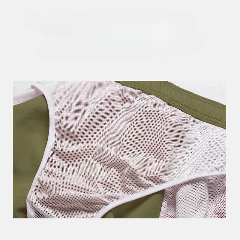 Pantalones cortos de tablero al por mayor los pantalones cortos de tiro sueltos de costura de hombres