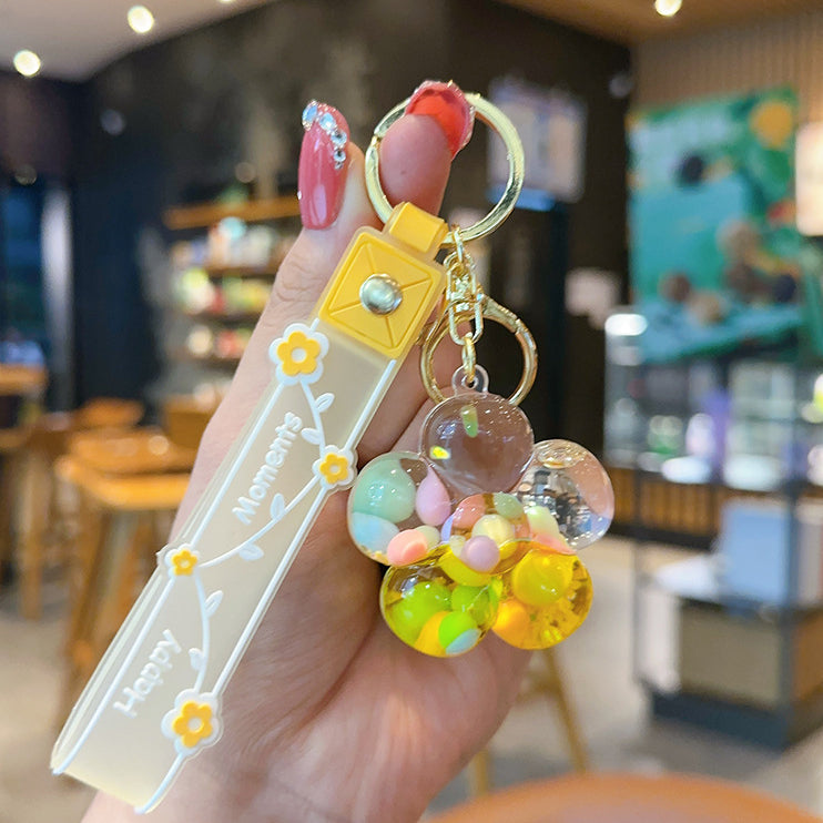 Wholesale Transparent Acrylic Oil Night Flower Flowing Sand Bottle Keychain
