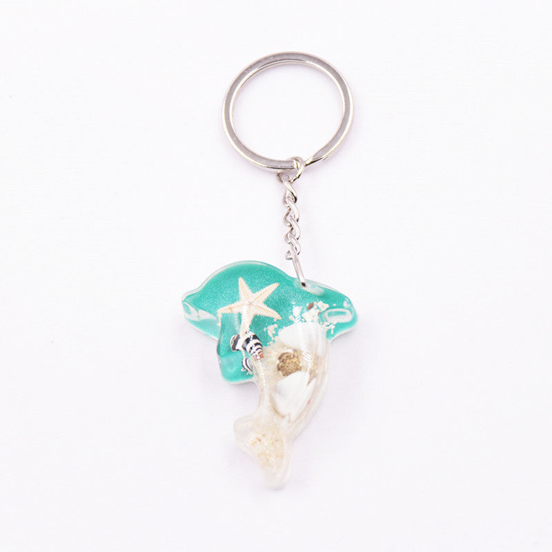 Mayorista 6pcs/paquete de resina Luminoso Stone Starfish Keychain