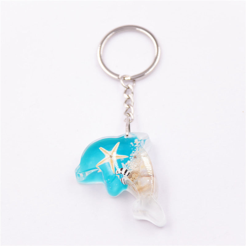 Mayorista 6pcs/paquete de resina Luminoso Stone Starfish Keychain