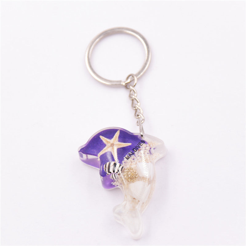 Mayorista 6pcs/paquete de resina Luminoso Stone Starfish Keychain