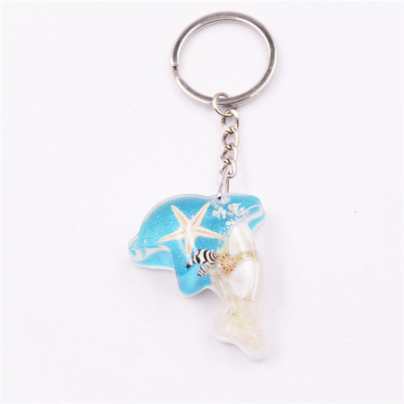 Mayorista 6pcs/paquete de resina Luminoso Stone Starfish Keychain