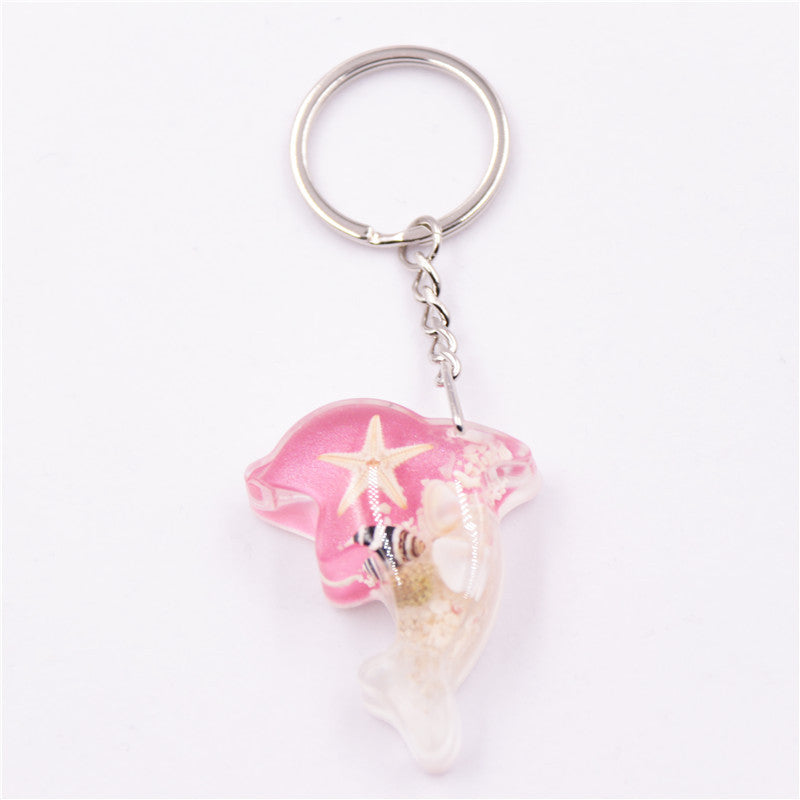 Mayorista 6pcs/paquete de resina Luminoso Stone Starfish Keychain