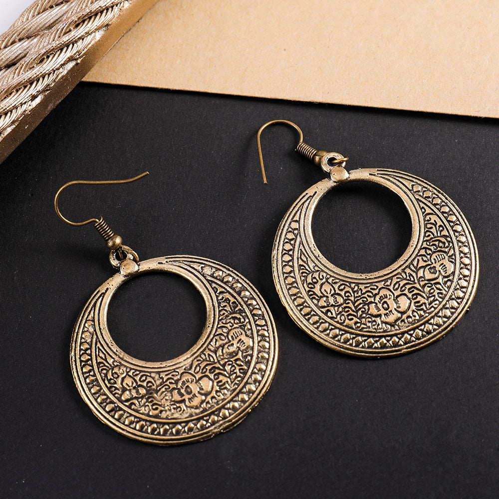 Wholesale Retro ethnic style totem pattern round hollow earrings