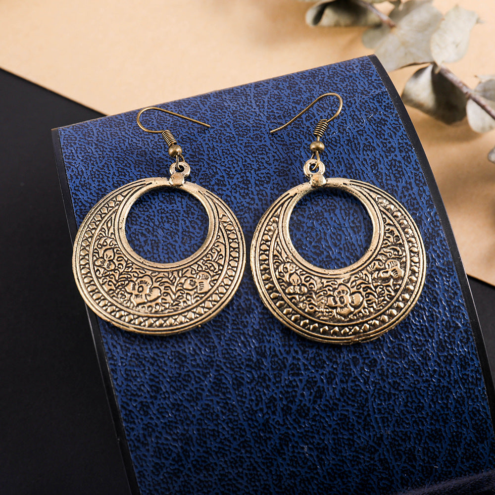Wholesale Retro ethnic style totem pattern round hollow earrings