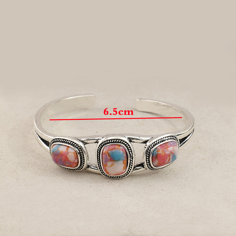 Wholesale Retro inlaid colored turquoise creative hollow pattern leaf alloy open bracelet