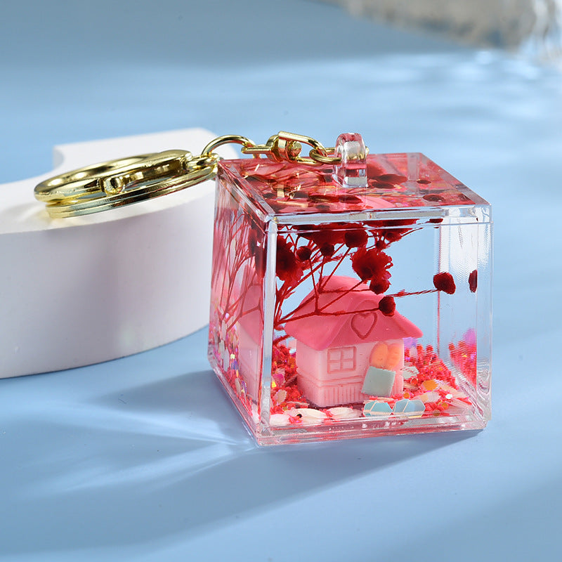 Wholesale Acrylic flowing sand in oil bottle keychain