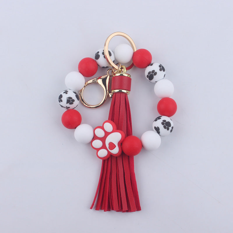 Wholesale Chic Silicone Bead Dog Paw Bracelet Keychain With Leather Tassel Fashion Gift For Resale