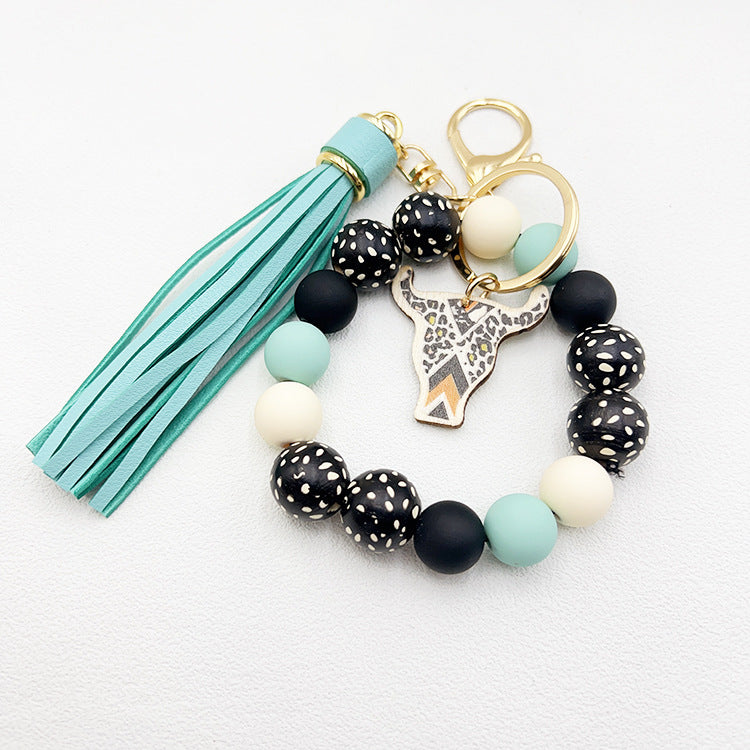 Wholesale Wooden Ox Head Sesame Spotted Wooden Beads PU Tassel Wrist Keychain