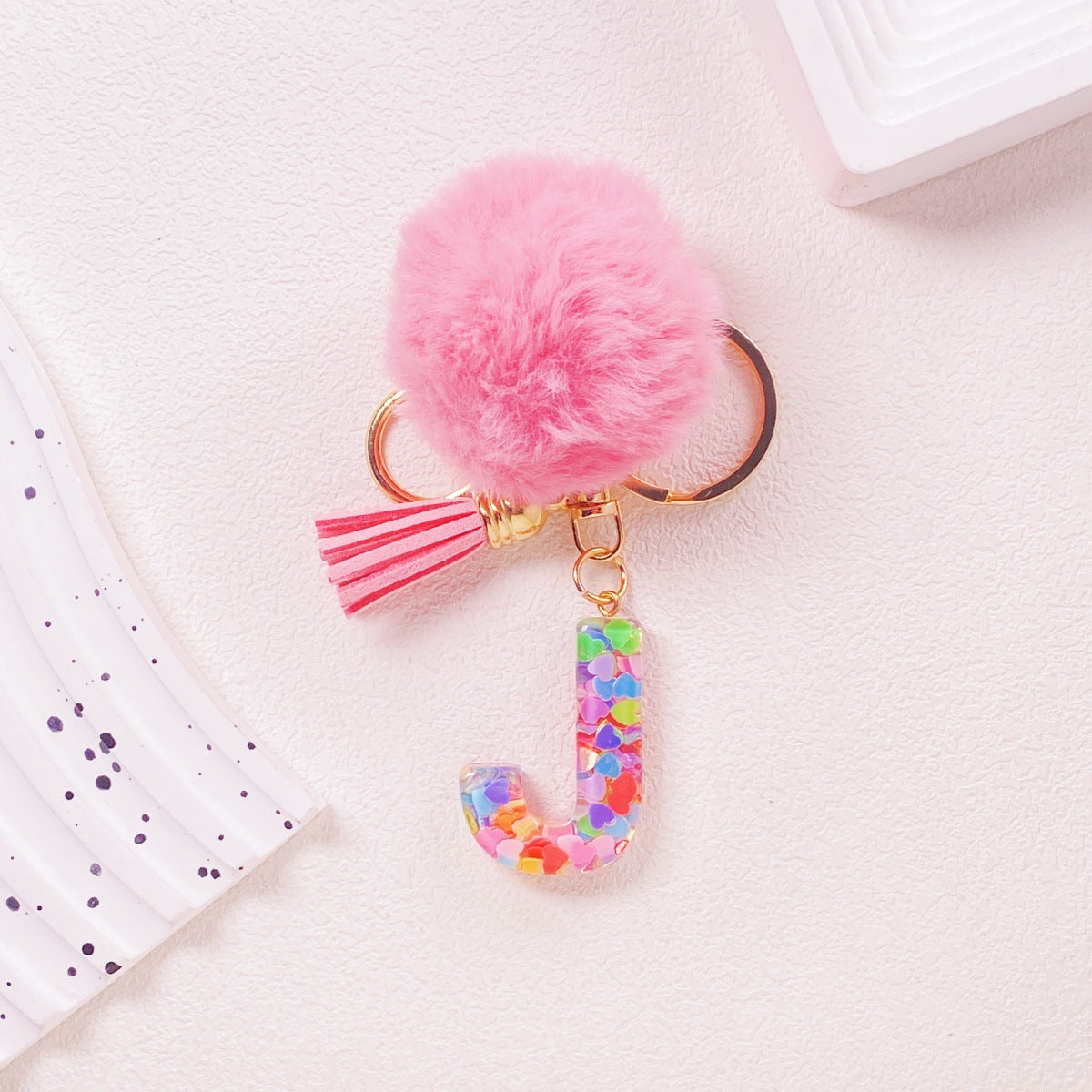 Wholesale Hairball English 26 letter pink Pom Pom keychain