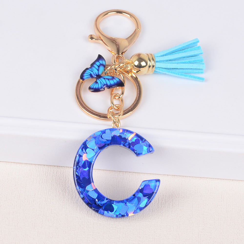 卸売ブルーラブバタフライタッセルレター樹脂キーホルダー