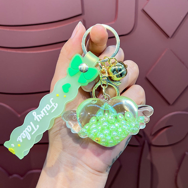 Wholesale Oil-infused Golden Bean Wing Heart Keychain