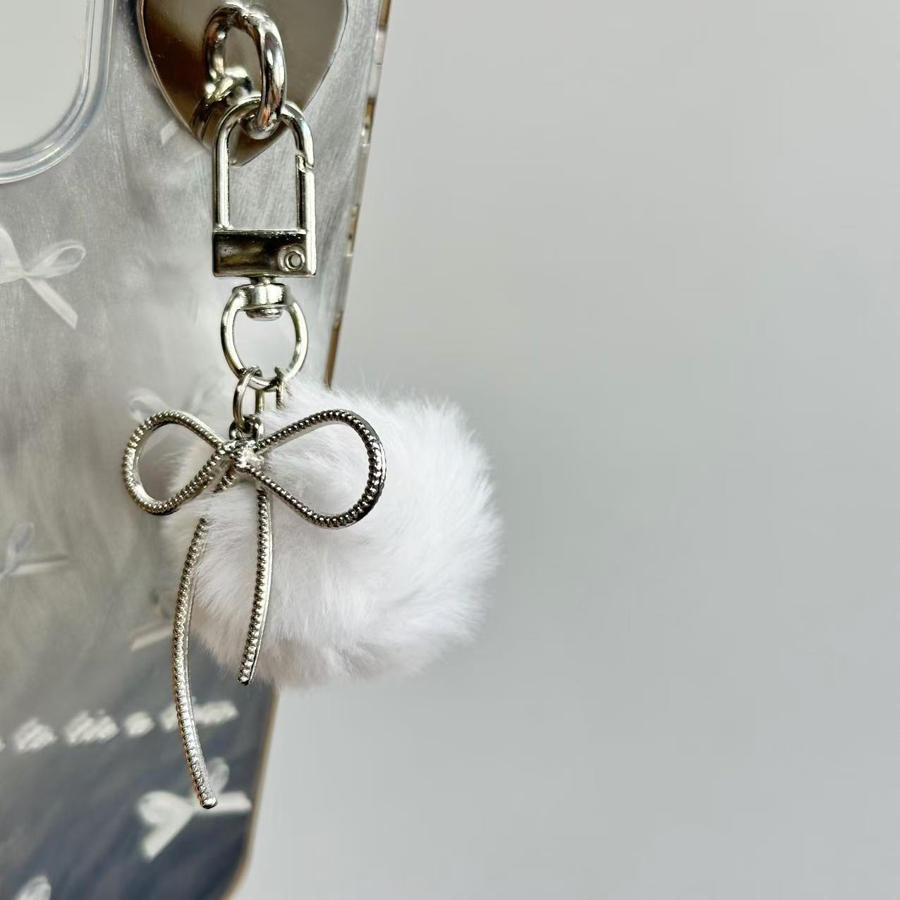 Wholesale Retro keychain with small fur ball and bow