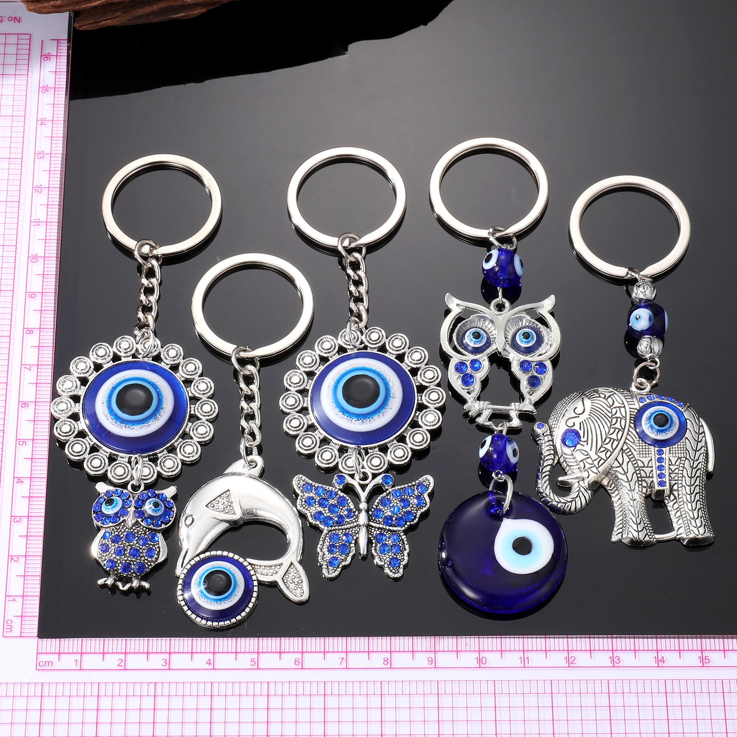 Al por mayor 5pcs Devil Eye Aloy Diamond Owl Dolphin Keychains