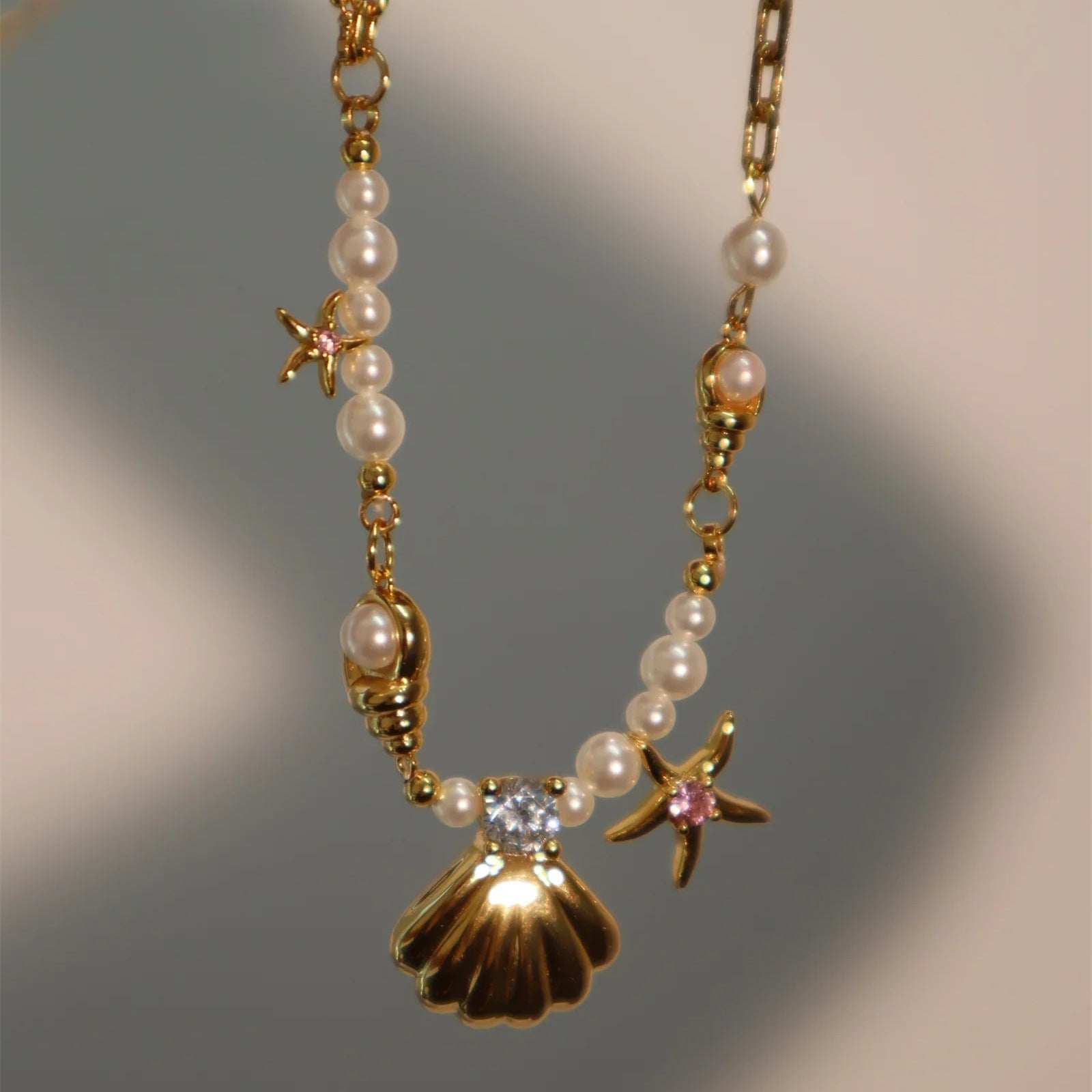 Wholesale Pearl Rice Pearl Star Mang Zircon Sea Star Shell Titanium Steel Necklace