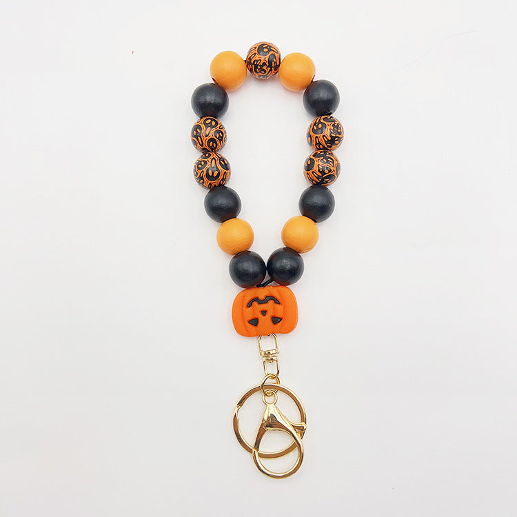 Wholesale Silicone Pumpkin Cow Ghost Dog Paw Wooden Bead Bracelet Keychain
