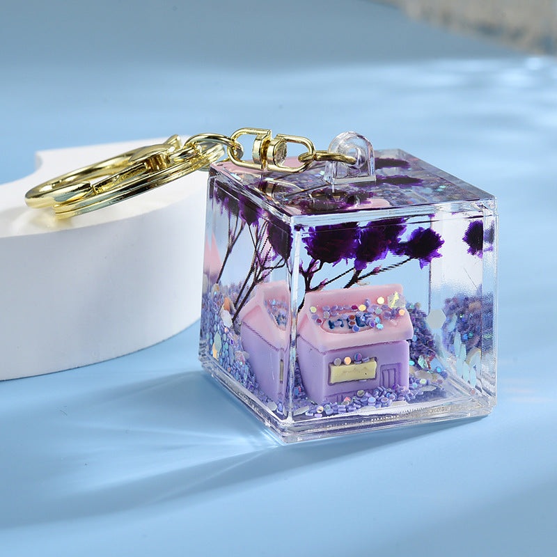 Wholesale Acrylic flowing sand in oil bottle keychain