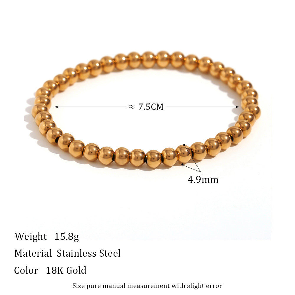 Wholesale Gold and silver colored round bead elastic stainless steel bracelets