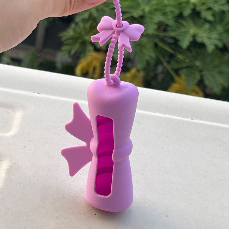 Wholesale Lipstick case silicone protective case bow lipstick bag keychain